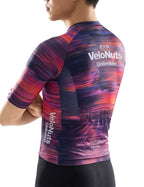 VeloNuts Men’s Short Sleeve Cycling Jersey with a Neon Gradient, Breathable Mesh Panels, YKK Zipper, and Three Rear Pockets.